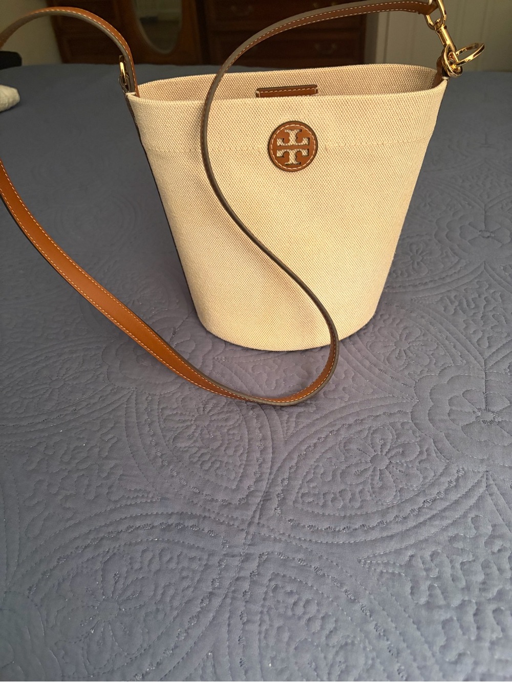 Tory Burch Cream Canvas Bucket Bag with Tan Leather Strap and Logo Medallion